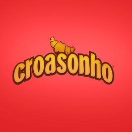 Logo "croasonho" com croissant sobre fundo vermelho.