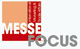 Logo mit Text: "MESSE FOCUS", Inkl. "International Marketing & Trade Affairs" in roten und orangen Kästchen.