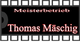 Schwarzes Schild mit Text: "Meisterbetrieb Thomas Mäschig" vor einem Filmstreifen-Hintergrund.
