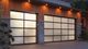 Modern garage with two frosted glass doors and warm lighting.