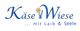 KäseWiese-Logo mit Löwenzahn, Slogan: "... mit Laib & Seele".