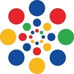 Cirkels in rood, blauw, geel en groen vormen een kleurrijk, symmetrisch patroon.