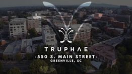 Aerial view of Greenville, SC, with Truphae logo and address: 550 S. Main Street, Greenville, SC.