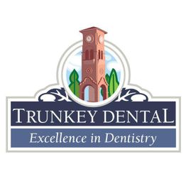 Trunkey Dental logo featuring a red clock tower and "Excellence in Dentistry" tagline.