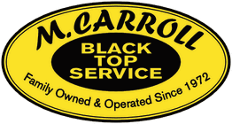 Yellow oval logo of M. Carroll Blacktop Service, family-owned since 1972.
