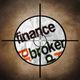 Crosshair targeting crumpled paper with the words "finance" and "broker" on it.