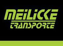Schriftzug "Meilicke Transporte" in grün auf schwarzem Hintergrund.