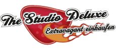 Rotes Logo mit Text "The Studio Deluxe" und "Extravagant einkaufen" in einer Flamme.