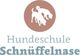 Logo der Hundeschule Schnüffelnase mit Silhouette von zwei schnüffelnden Hunden.