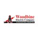 Logo of Woodbine Electric Company with oil rig and red lightning bolt.