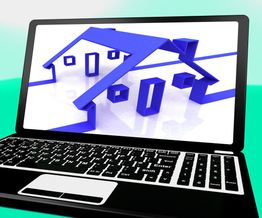 Laptop screen displaying a 3D blue house model.