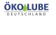 Logo von ÖkoLube Deutschland mit grünem Tropfen als O, blauer Schriftzug auf weißem Hintergrund.