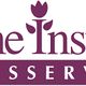 Logo van Home Instead Thuisservice met paars-witte kleuren en een tulp boven de letter "I".