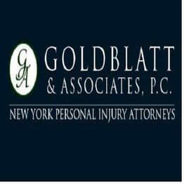Goldblatt & Associates logo, New York personal injury attorneys, dark background.