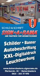 SIGN-A-RAMA Werbetechnik-Geschäft innen mit Schildern, Bannern und Infos zur Leuchtwerbung.