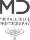Logo von "MD Michael Diehl Photography" mit dekorativem Ornament darunter.