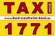 Gelbes Schild mit rotem Text "TAXI" und der Nummer "1771", Webseite: www.bad-nauheim-taxi.de.