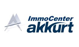Logo von ImmoCenter Akkurt mit stilisiertem 'A' in Grautönen.