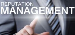 Man in suit pointing at glowing "Reputation Management" text.