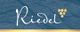 Logo mit dem Schriftzug "Riedel" und Traubenmotiv auf blauem Hintergrund mit goldener Linie.