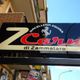 Insegna di macelleria equina "ZCarne di Zammataro" su una via cittadina.
