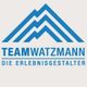 Blaues Logo mit Bergsymbol, Text: "TEAM WATZMANN, DIE ERLEBNISGESTALTER".