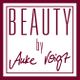 'Beauty by Anke Voigt' auf weißem Hintergrund in bordeauxfarbenem Rahmen.