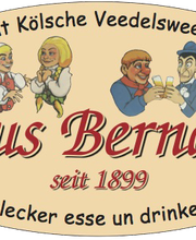 Alt-Text: "Ovales Logo mit Text 'Haus Bernards', Karikaturen von zwei Paaren, etabliert 1899."