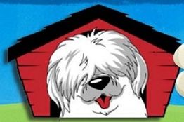 Cartoon dog with shaggy fur sitting in a red doghouse, smiling with tongue out.
