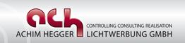 Logo von "ACHIM HEGGER LICHTWERBUNG GMBH" mit rotem "ach"-Schriftzug und grauem Hintergrund.