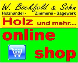 Gelbes und grünes Schild: Holzhandel und Online-Shop mit Einkaufswagen-Symbol.