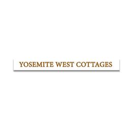 Sign reading "Yosemite West Cottages" in brown text on a white background.