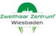Logo des Zweithaar Zentrums Wiesbaden, grüner Schriftzug mit stilisiertem Haarmotiv.