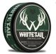 Green can of Whitetail Smokeless Wintergreen tobacco, featuring antler logo. Warning label visible.