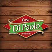 Logo da Casa Di Paolo sobre fundo de madeira com design em vermelho, verde e estrelas.