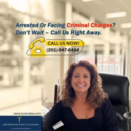 Woman in office with law firm's contact for criminal charges inquiry.