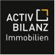 Logo mit Text "ACTIV BILANZ Immobilien" auf schwarzem Hintergrund mit grafischem Element.