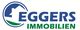 Logo von Eggers Immobilien mit einem Haus im Kreis und blau-grünem Text.