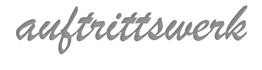 Schriftzug "auftrittswerk" in grauer, geschwungener Schrift auf weißem Hintergrund.