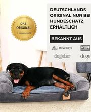 Hund liegt auf einem grauen Hundebett. Text bewirbt exklusives Produkt von Hundeschatz.