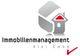 Logo der Immobilienmanagement Kiel GmbH mit stilisiertem Haus und rotem Häkchen.