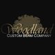 "Woodland Custom Beam Company logo with a stylized tree silhouette in the background."