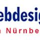 Text "Webdesign in Nürnberg" in blauen und roten Buchstaben auf weißem Hintergrund.