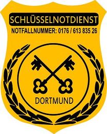 Gelbes Schild mit zwei Schlüsseln, Lorbeerkranz und Text: "Schlüsselnotdienst Dortmund".