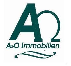 Logo von A&O Immobilien mit grünen Buchstaben und geschwungener Linie darunter.