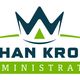 Logo van Johan Kroon Administratie met kroon en groene en blauwe kleuren.
