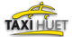 Logo von Taxi Huet: Gelbes Autodach auf schwarzem Hintergrund mit Schriftzug.