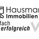 WHS Hausmann Immobilien Logo, Text: "einfach erfolgreich" mit grauem Haken.