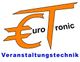 Logo mit Eurozeichen und "Tronic", darunter steht "Veranstaltungstechnik" in blauer Schrift.