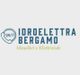 Logo di "Idroelettra Bergamo" con testo "Idraulici e Elettricisti" e icona telefono 24/7.